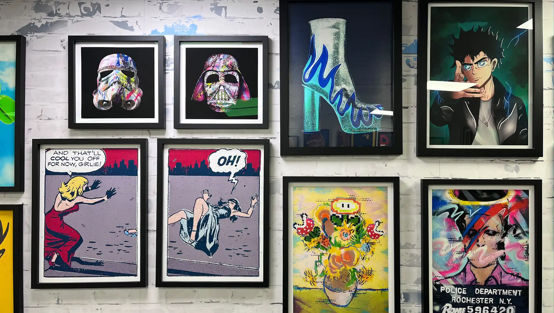 Selection of framed art prints in various sizes displayed on a wall, showcasing a diverse range of artwork styles and designs.