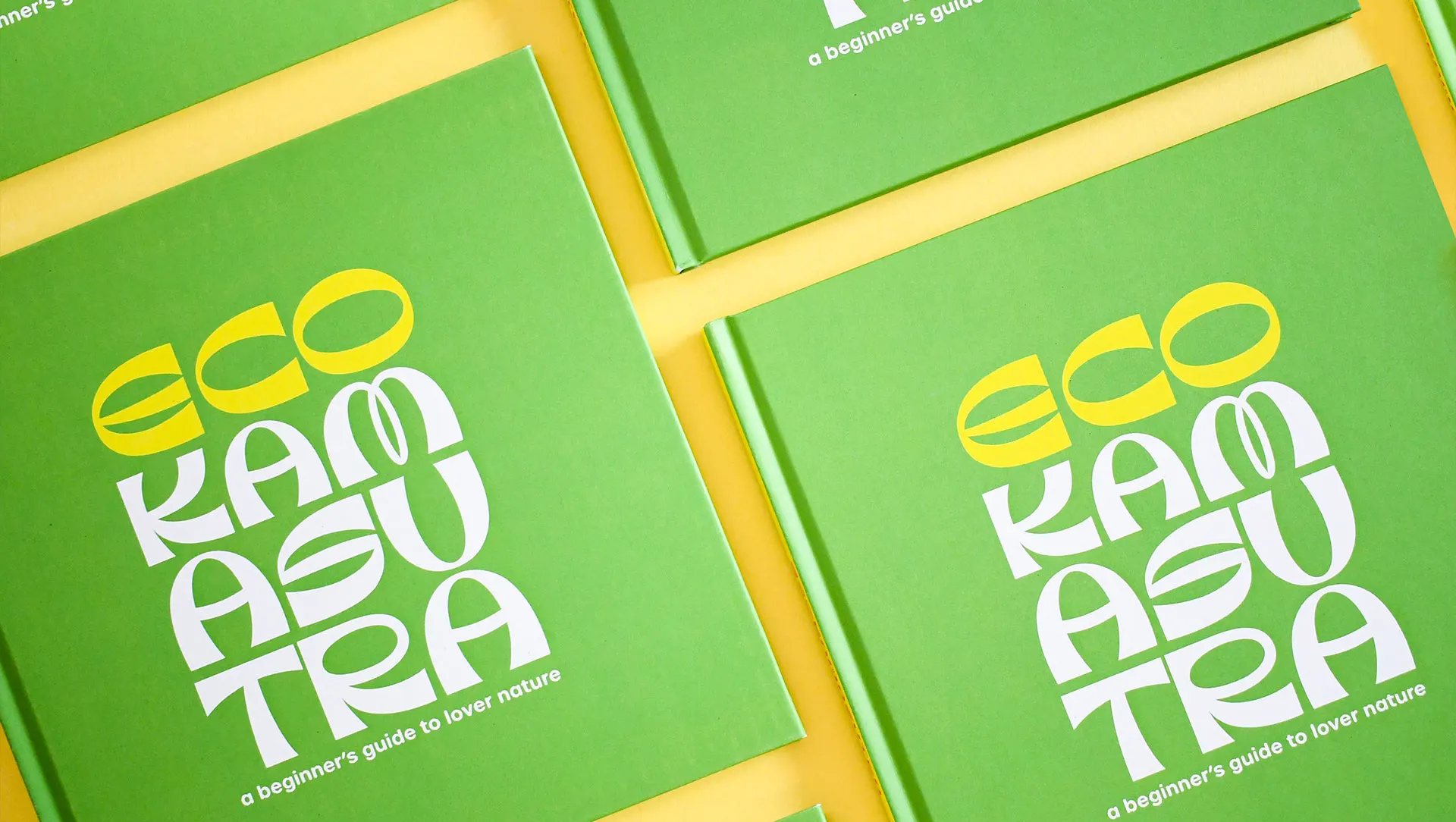 Multiple copies of the book 'Eco Kamasutra' arranged neatly in an organised manner, ready for distribution or display.