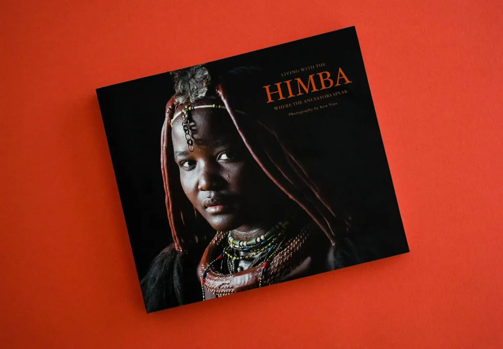 The cover of a stunning lay-flat photography book titled 'Living with the Himba: Where the Ancestors Speak,' capturing the essence of a cultural journey through captivating imagery.