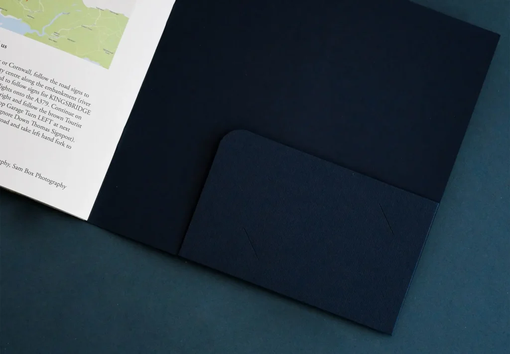 The inside of a brochure featuring a convenient folded pocket, designed to hold items like business cards for easy access and organisation.