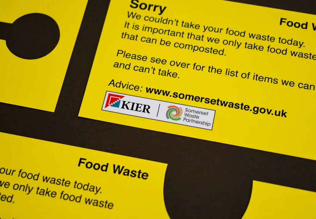 A close up of multiple bin labels spread out against a black backdrop, ensuring clarity and visibility that the waste could not be collected.