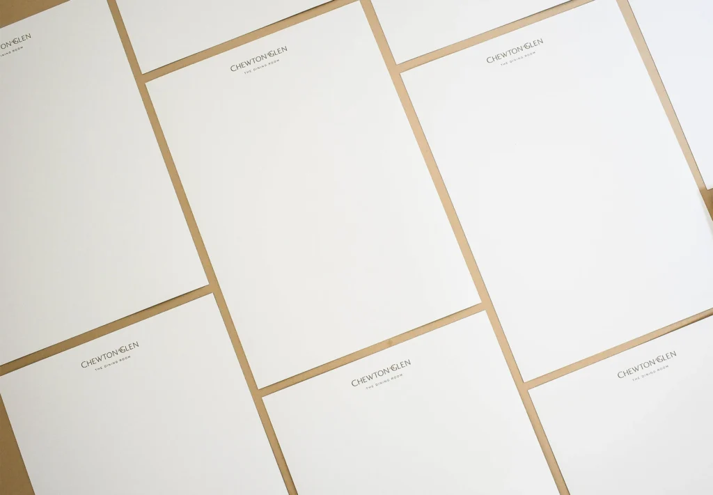 An array of letterheads printed for a hotel, neatly arranged.