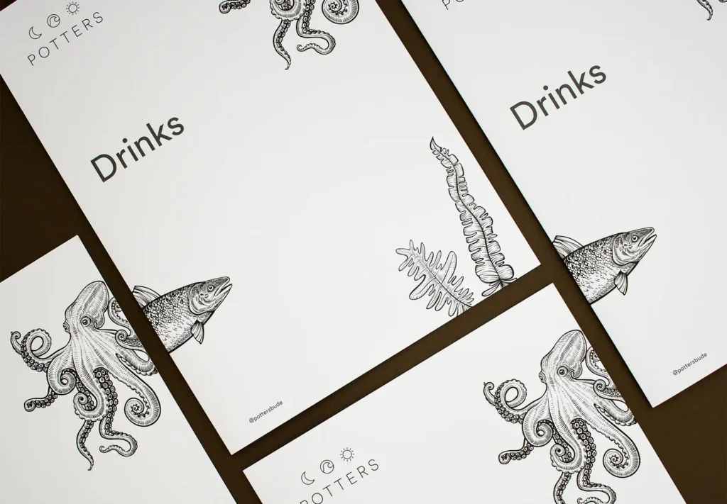 Exquisite menu covers featuring meticulously hand-drawn illustrations of sea creatures.