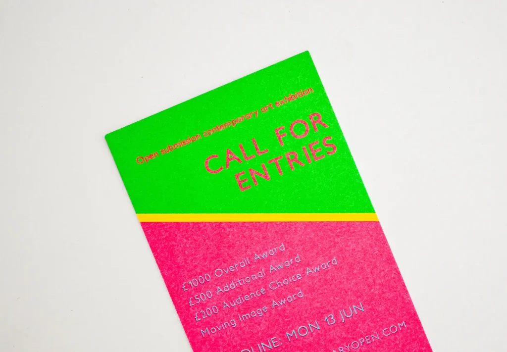 A close up of an eye-catching flyer printed using fluorescent inks.