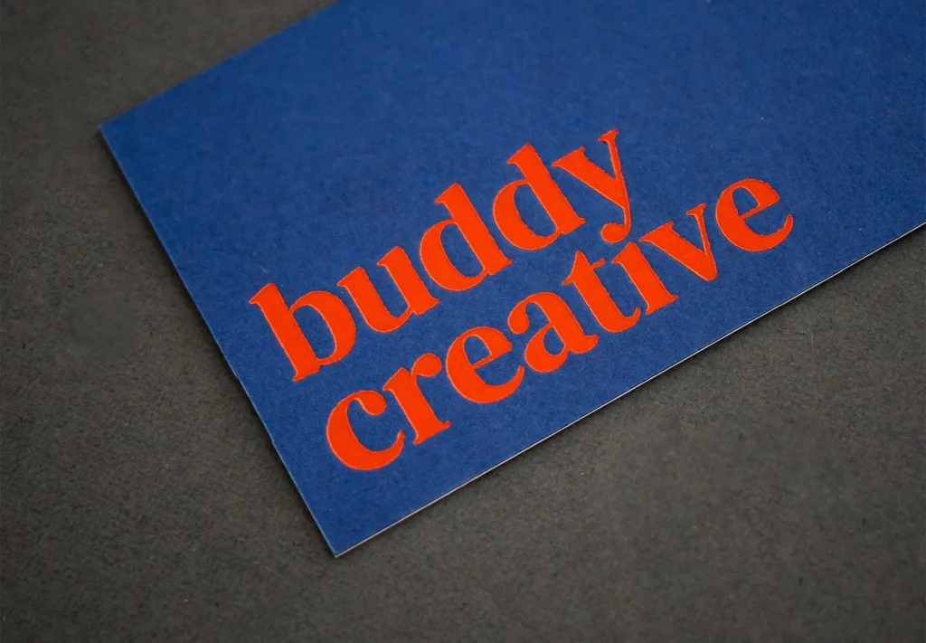 a close up of a business card for a creative agency.