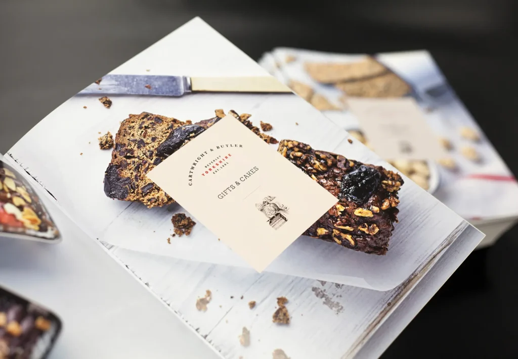 Brochure showcasing a range of gifts and cakes, with eye-catching images.