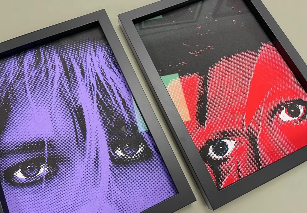 Two art prints of famous musicians in vibrant, bold colours.