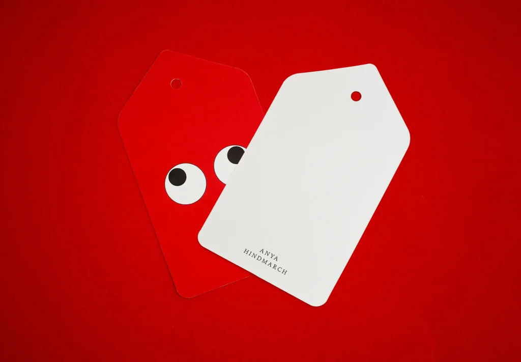 A playful retail label featuring an illustration of googly eyes, adding a touch of charm to the product presentation.