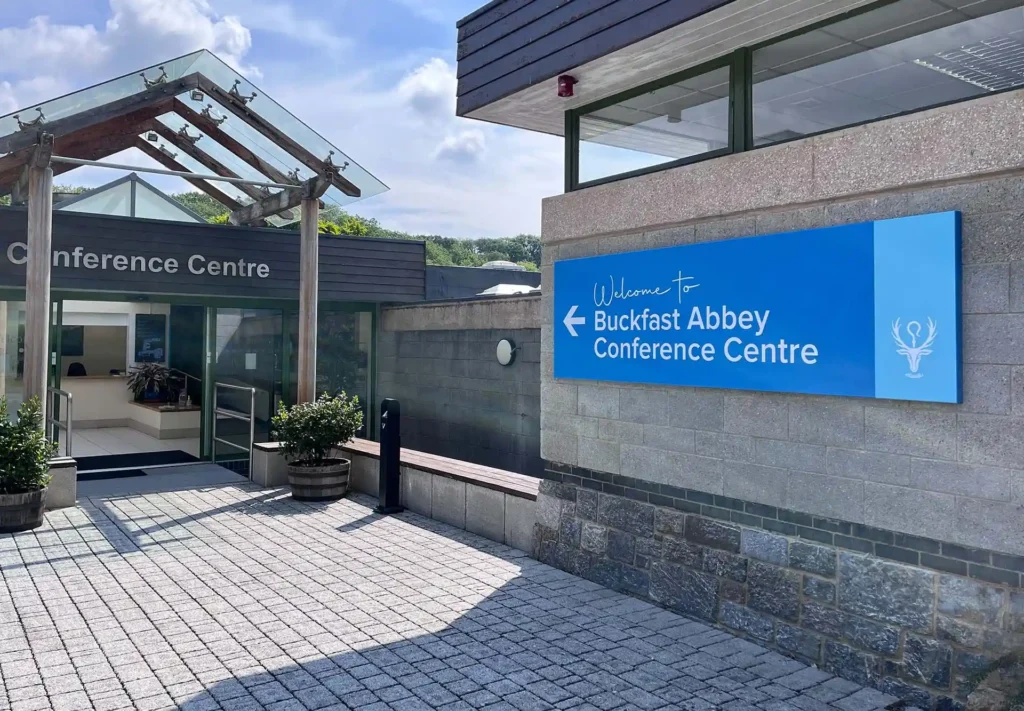 Large 3D sign at Buckfast Abbey entrance to conference centre