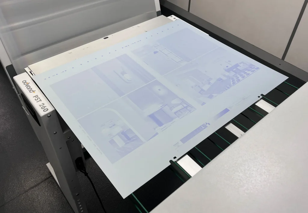 A brochure being made into plates for the lithography printing process.