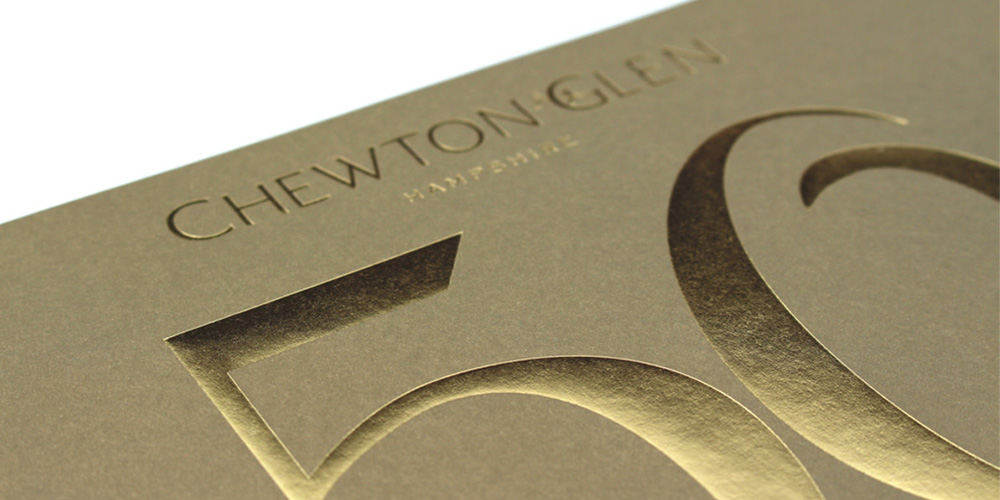 gold foil number on a hotel brochure