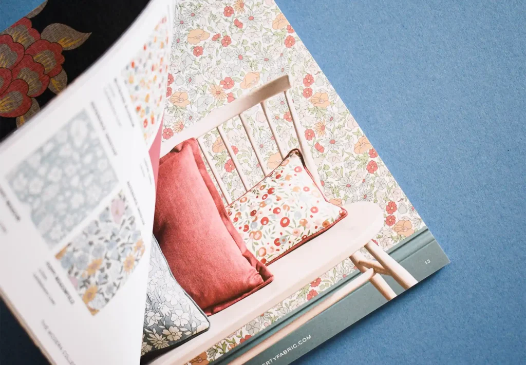 A detailed close-up of a page from the Liberty Fabric magazine, emphasising the exceptional print quality.