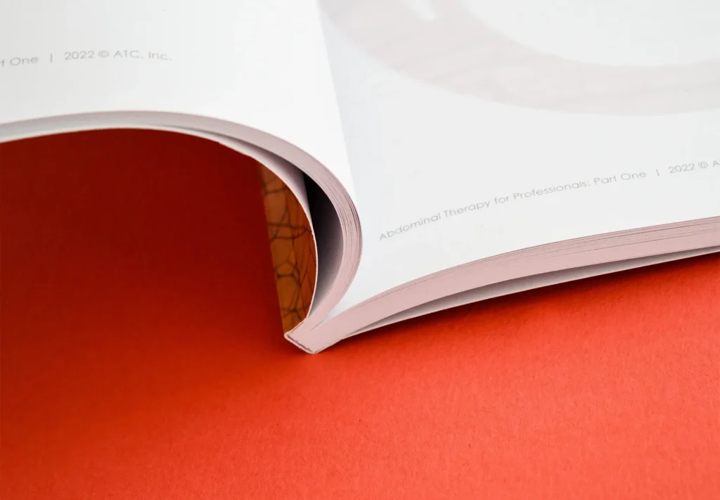 A closeup of the spine of a professionally printed brochure.