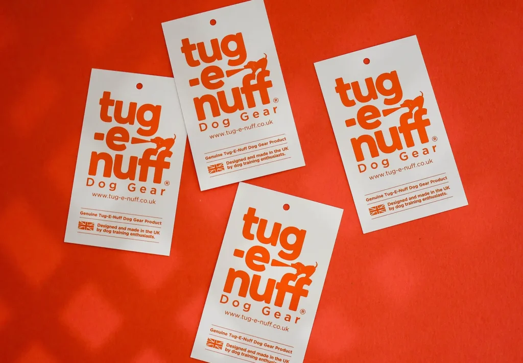 A collection of tags for tug-e-nuff dog gear.