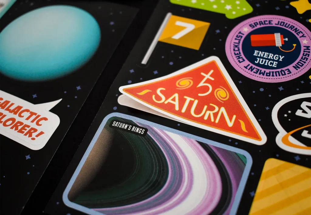 A space themed sticker sheet containing stickers of all shapes and sizes.